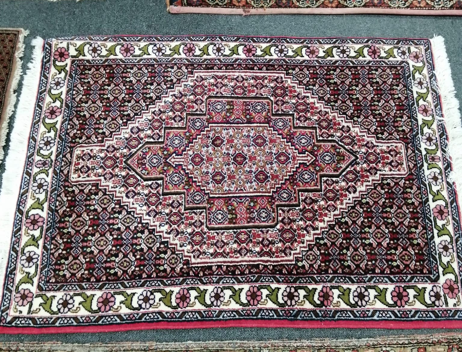 A North West Persian red ground rug, a Tabriz blue ground rug and two smaller modern rugs, largest 254 x 172cm